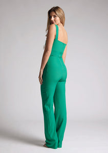 Back quarter image of a model wearing an emerald  jumpsuit with a sweetheart neckline, wide straps and a keyhole cut-out detail under bust, this style is finished with a wide leg. The style featured is Vesper Collette Emerald Jumpsuit.