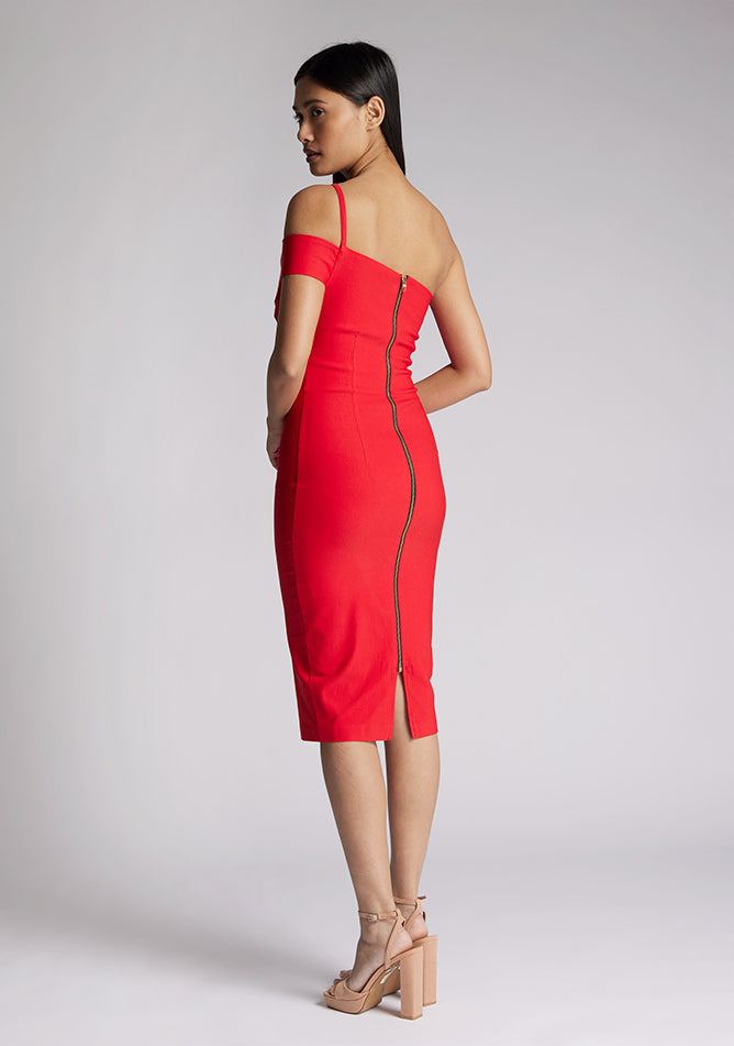 Back quarter image of model wearing a red one shoulder midi dress with a cut out one shoulder detail and has a zip centre back fastening. The design featured is the Vesper Emma Red One Shoulder Midi Dress